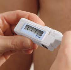 Portable Holter monitor device displaying heart rhythm